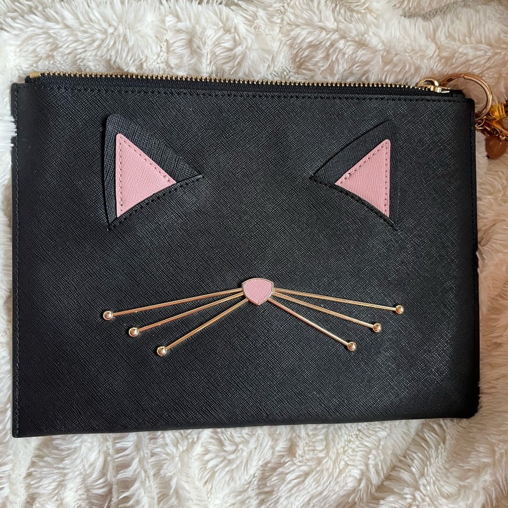 Kate Spade clutch purse, cats meow (rare find) black/white inside with 1 pocket.